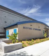 Exterior with Mustang Gymnasium lettering