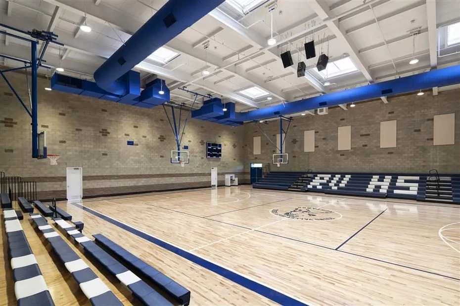 Gym interior with maple court and bleachers